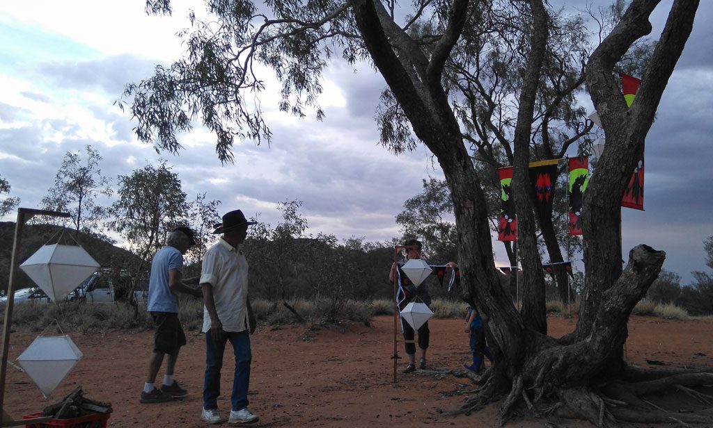 Peace Bus crew and local Arrernte elders set up the space around the Emu tree