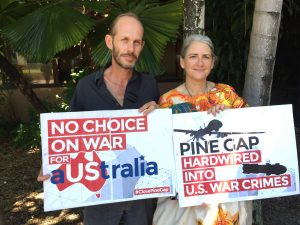Cairns Peace Pilgrims - Paul Christie and Margaret Pestorius. Margaret is in her wedding dress - hand painted silk with symbols of peace such as doves and the peace sign